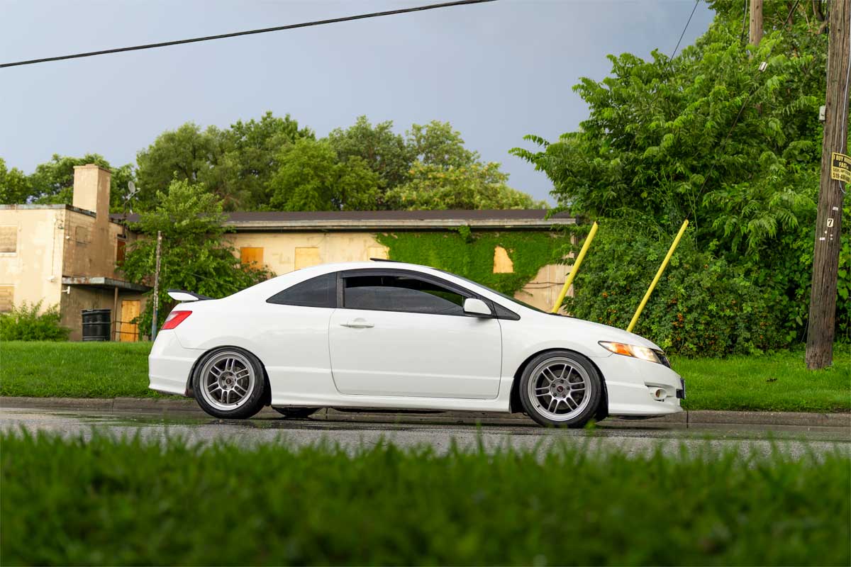 Clean Honda Civic FG2 shot streetside after a summer rain in Windsor