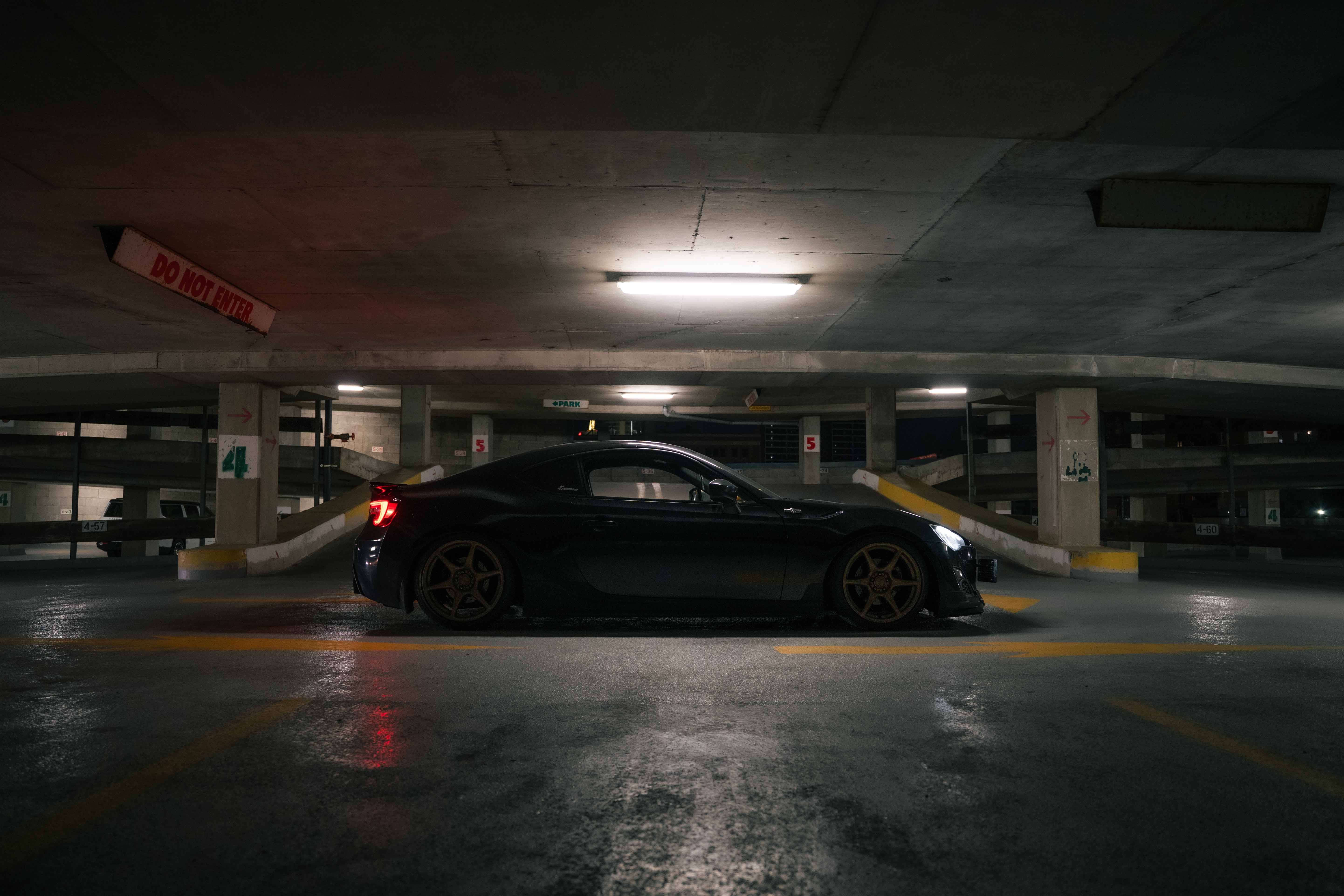 Mack’s FRS in a dimly lit garage with golden wheels