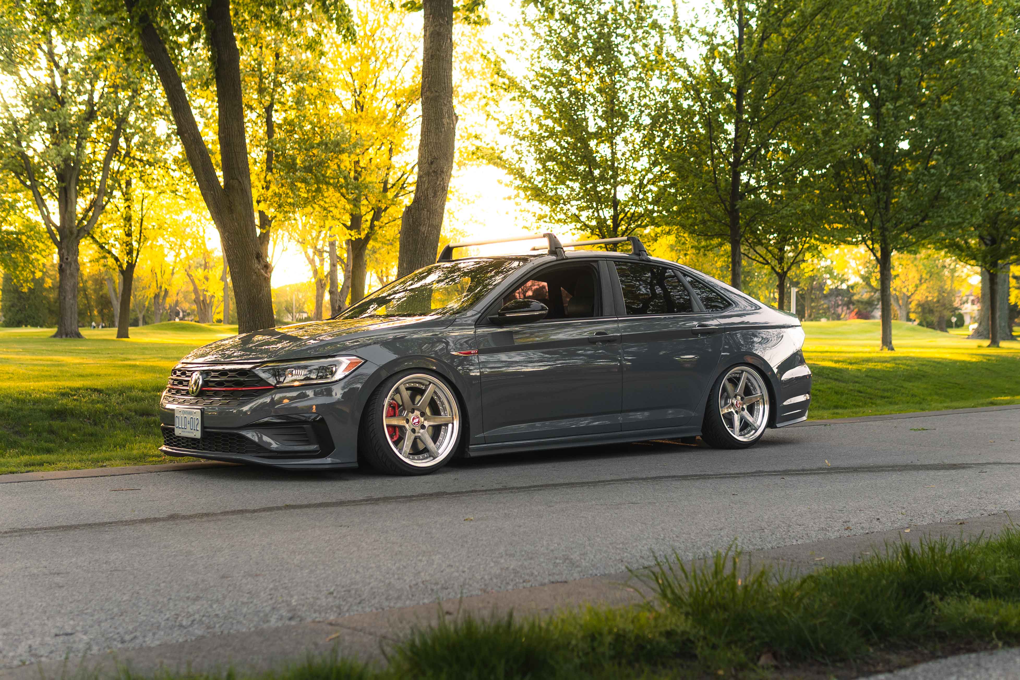 Wide panning shot of a VW Jetta GLI at golden hour in Windsor
